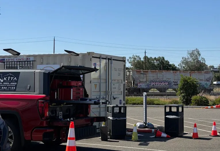 Kita Locks mobile service truck with locksmith equipment at a work location.