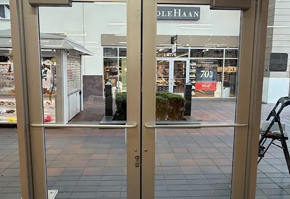 Storefront glass doors viewed from inside the building.