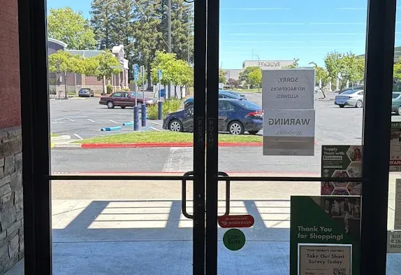 Exterior view of a glass storefront entrance.