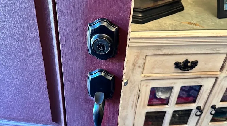 Residential deadbolt and lever lock on an entry door