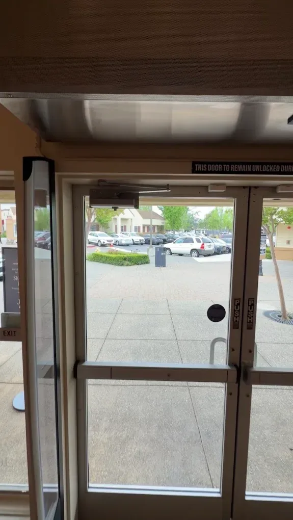 Commercial glass door and entrance viewed from the interior.