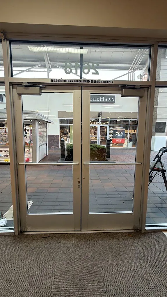 Storefront glass doors viewed from inside the building.
