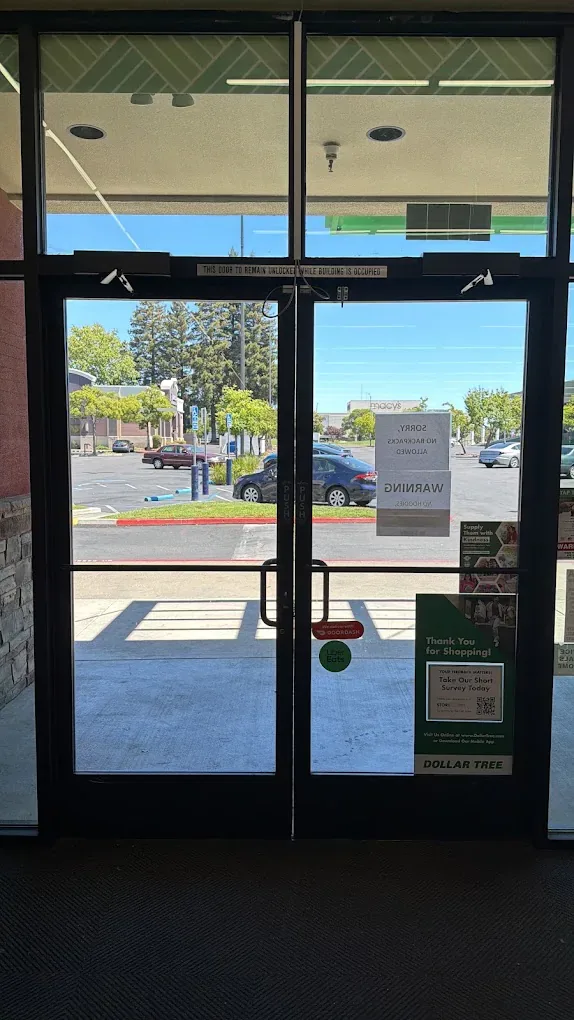 Exterior view of a glass storefront entrance.