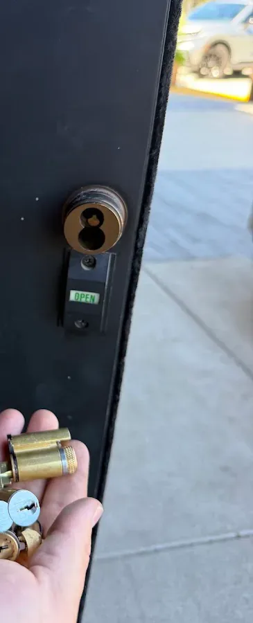 Close-up of a commercial door cylinder and keys.
